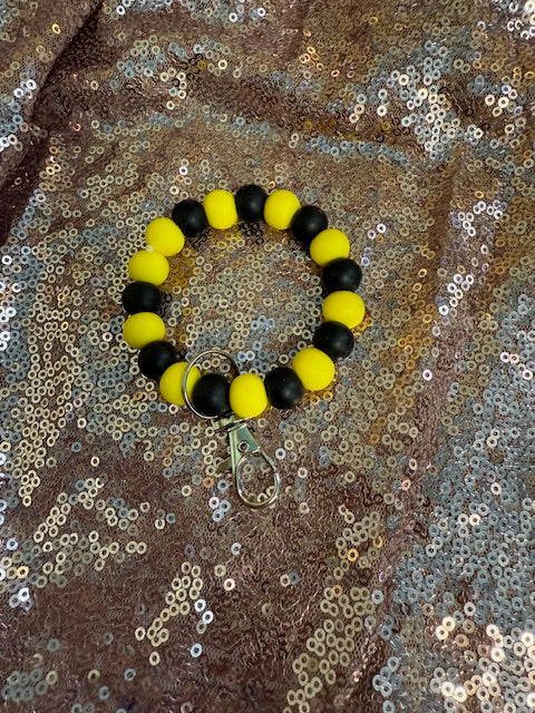 black and yellow wristlet